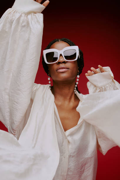 istock Wearing Stylish Sunglasses and Flowing White Blouse 2198920886