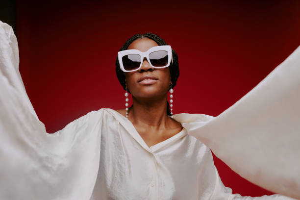 istock Woman Posing with Outstretched Arms in White Outfit 2198920888