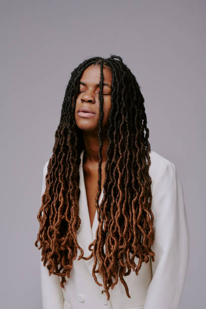 istock Closing Eyes Wearing White Blazer with Long Twist Braids 2198921506