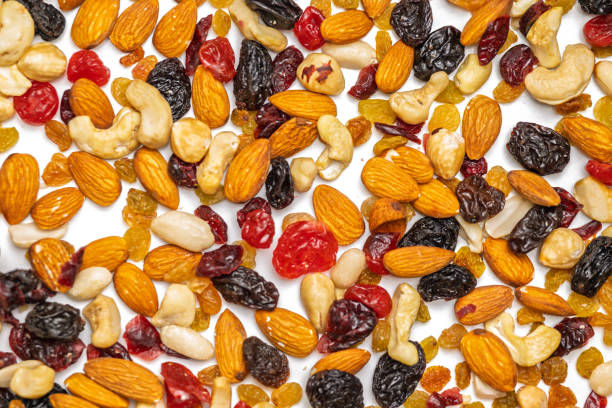istock background of nuts and dried fruits 2198922599