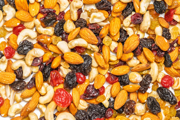 istock background of nuts and dried fruits 2198922600