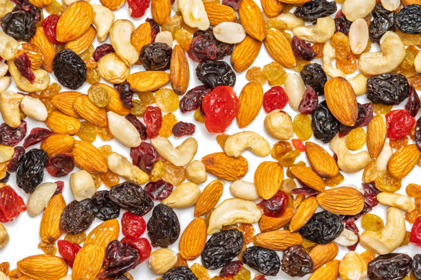 istock background of nuts and dried fruits 2198922610