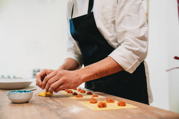 istock Chef preparing delicious italian ravioli in a restaurant kitchen 2198923990