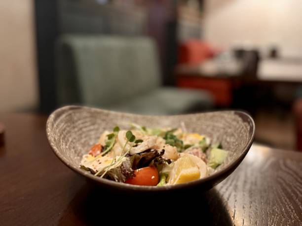 istock Delicious Fresh Seafood Salad Accompanied by a Creamy Dressing and Fresh Microgreens 2198926468