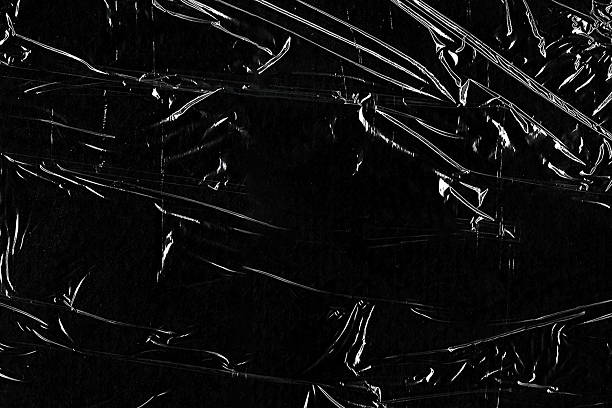 istock Closeup plastic vinyl torn wrap textures. Vector illustration show various crinkled, wrinkled, and transparent plastic wraps with different tear patterns. Ideal for design overlays and shadow effect. 2198928582