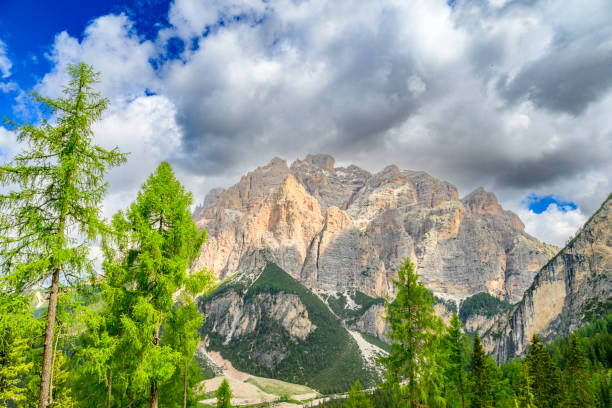 Dolomites landscape with the  Cunturines Spitze / Piz dles Conturines in the background durint a beautiful springtime day in South Tyrol.