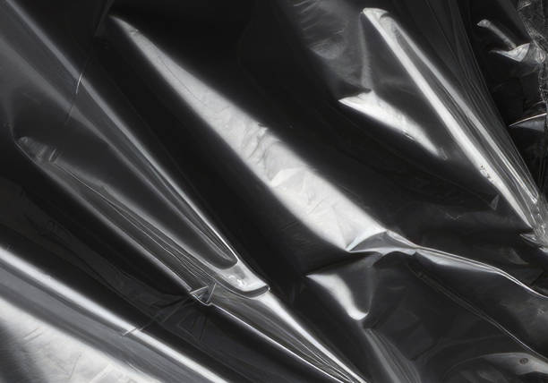 istock Closeup plastic vinyl torn wrap textures. Vector illustration show various crinkled, wrinkled, and transparent plastic wraps with different tear patterns. Black gray design overlays and shadow effect. 2198929436