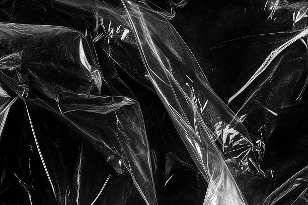 istock Closeup plastic vinyl torn wrap textures. Vector illustration show various crinkled, wrinkled, and transparent plastic wraps with different tear patterns. Black gray design overlays and shadow effect. 2198930056