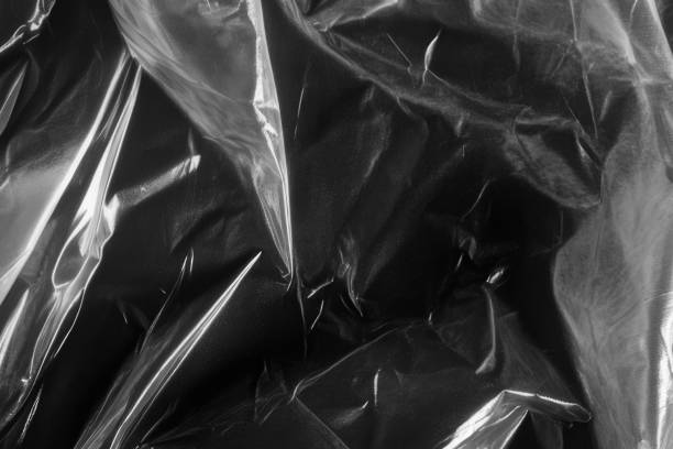 istock Closeup plastic vinyl torn wrap textures. Vector illustration show various crinkled, wrinkled, and transparent plastic wraps with different tear patterns. Black gray design overlays and shadow effect. 2198930065