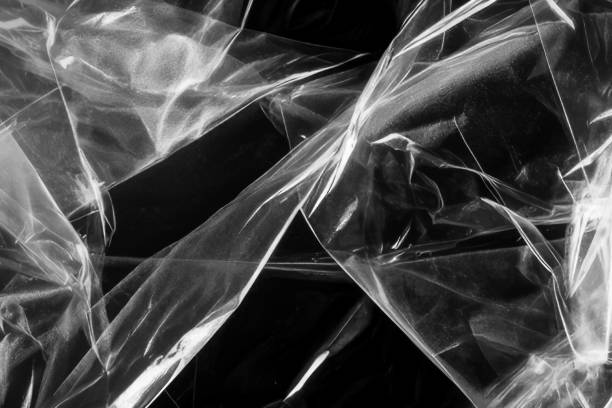 istock Closeup plastic vinyl torn wrap textures. Vector illustration show various crinkled, wrinkled, and transparent plastic wraps with different tear patterns. Black gray design overlays and shadow effect. 2198930074
