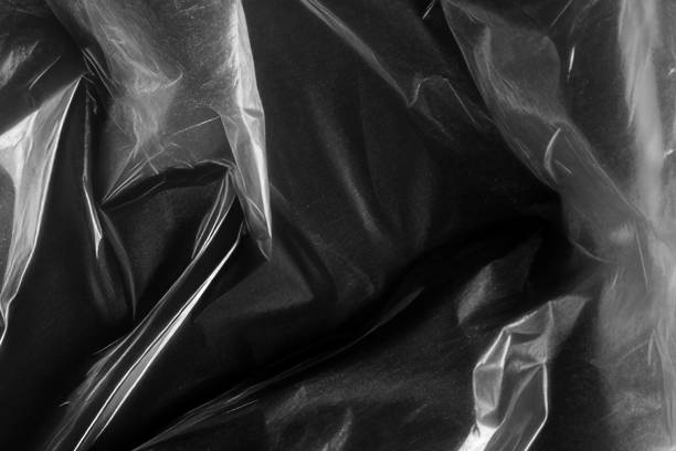 istock Closeup plastic vinyl torn wrap textures. Vector illustration show various crinkled, wrinkled, and transparent plastic wraps with different tear patterns. Black gray design overlays and shadow effect. 2198930075