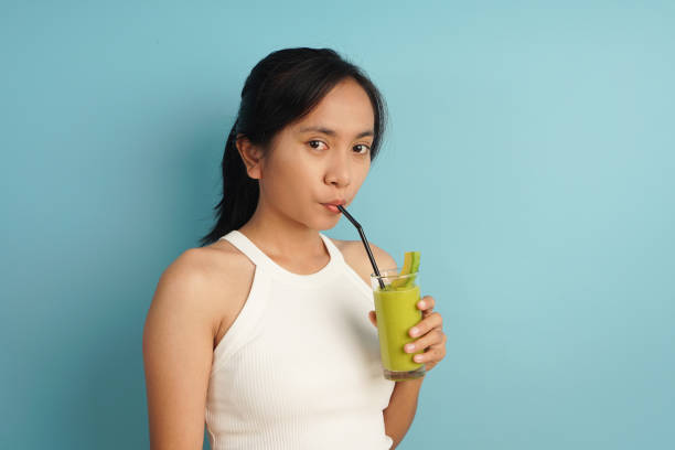 istock woman drinking smoothies with avocado 2198930131