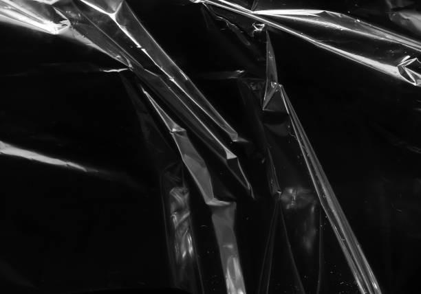 istock Closeup plastic vinyl torn wrap textures. Vector illustration show various crinkled, wrinkled, and transparent plastic wraps with different tear patterns. Black gray design overlays and shadow effect. 2198930273