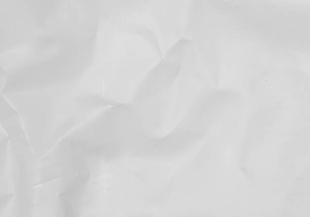 istock White recycled craft paper texture as background. Grey paper texture, Old vintage page or grunge vignette of old newspaper. Pattern rough art creased grunge letter. Hardboard with copy space for text. 2198930348