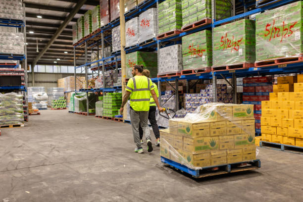 istock Men working collaboratively in a distribution warehouse in Sydney to manage e-commerce logistics and shipping processes 2198930527
