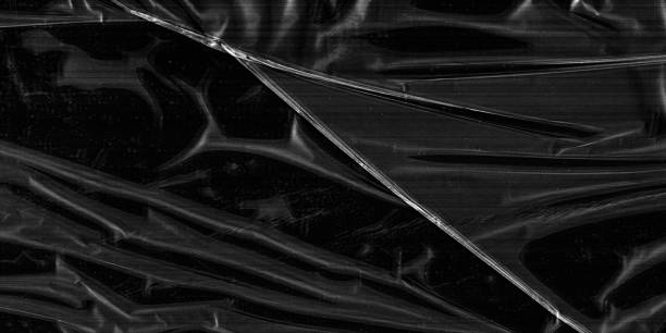 istock Closeup plastic vinyl torn wrap textures. Vector illustration show various crinkled, wrinkled, and transparent plastic wraps with different tear patterns. Black gray design overlays and shadow effect. 2198930577