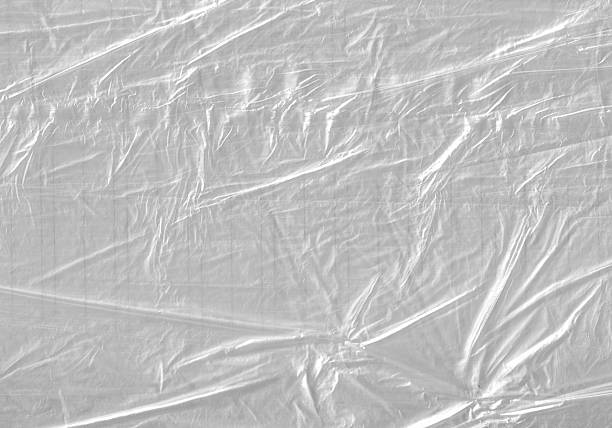 istock White Plastic wrinkle Bag Film Glossy Cumpled Overlay Package Background Rough Wrap Material Pack Reflection Texture Floor Packaging Retail Grain Pollution Trash, surface wrinkled Foil Polyethylene. 2198930637
