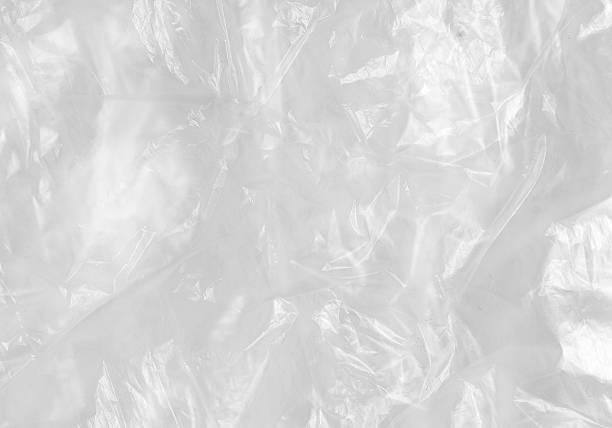 istock White Plastic wrinkle Bag Film Glossy Cumpled Overlay Package Background Rough Wrap Material Pack Reflection Texture Floor Packaging Retail Grain Pollution Trash, surface wrinkled Foil Polyethylene. 2198930689