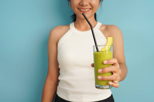 Woman giving avocado juice