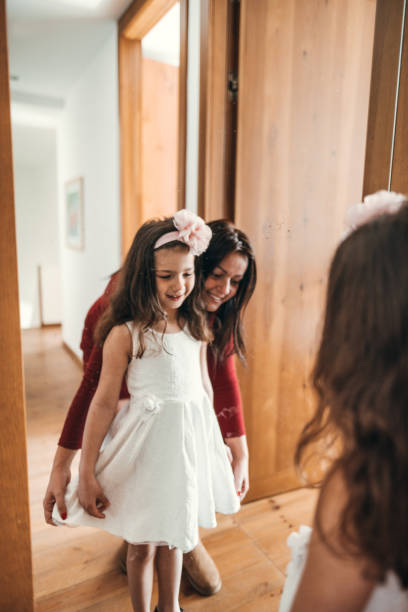 istock get dressing in front of the mirror 2198931133