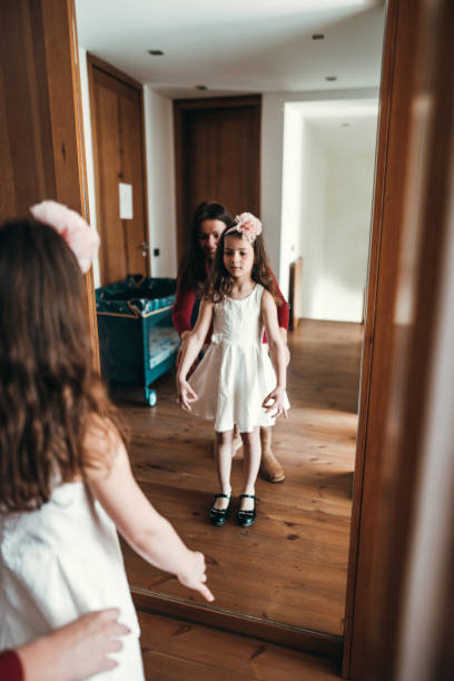 istock get dressing in front of the mirror 2198931456
