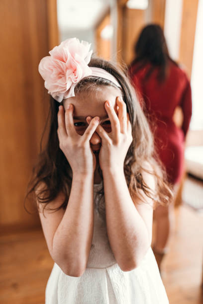 little daughter make a face at home
