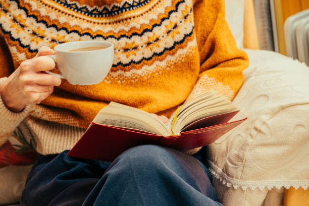 istock Relaxing with a book and hot drink 2198931589