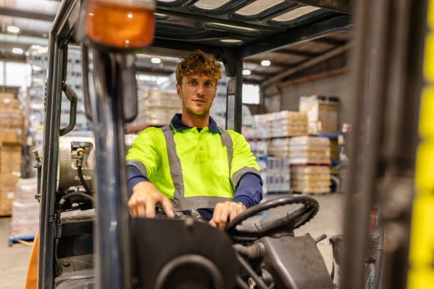 istock Warehouse worker operating forklift in distribution center during daytime in Sydney, Australia 2198931720