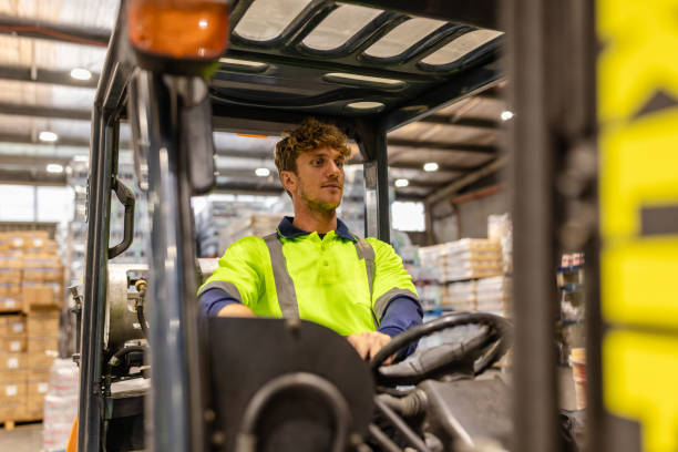 istock Man operating forklift in distribution warehouse in Sydney, Australia during work hours 2198931757