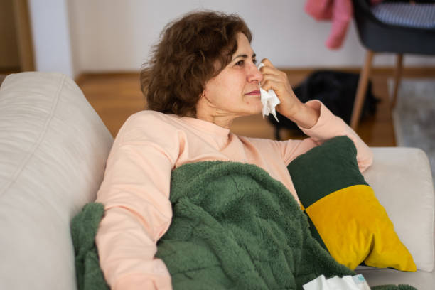 istock Senior woman feeling unwell at home 2198934545