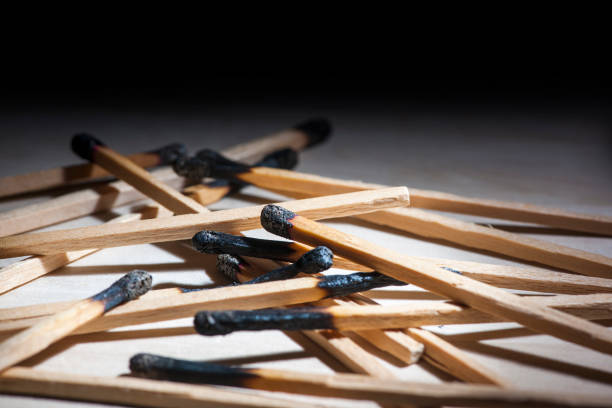 Matchsticks in a box. Matches with black heads. Matches with brown heads. All for design