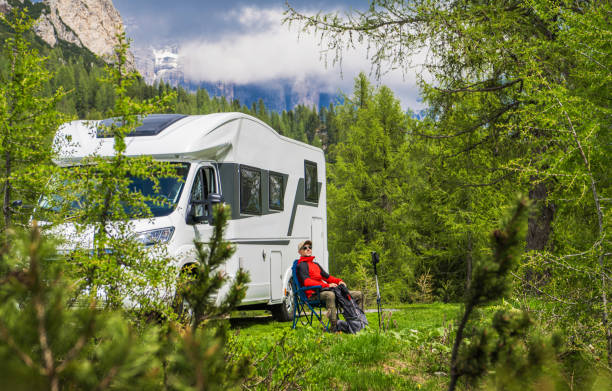 istock Nature Retreat in a Camper Van Surrounded by Tall Trees 2198936220