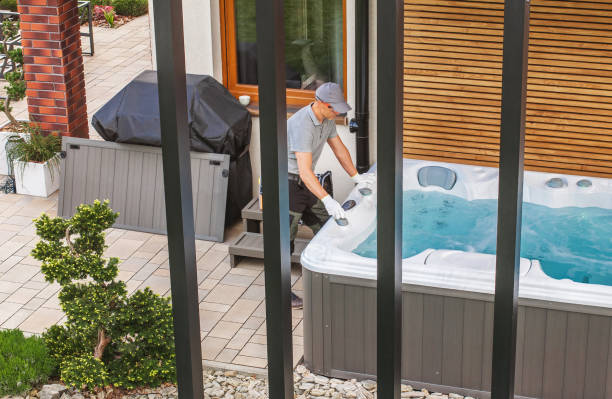 istock Man Maintaining Hot Tub in a Backyard During Daylight Hours 2198936647
