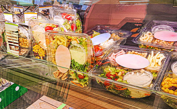 istock Prepackaged salads and drinks in a commercial supermarket refrigerator 2198939336