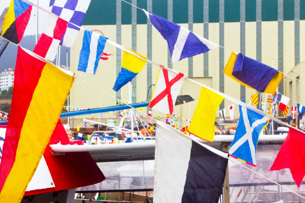 International maritime signal flags. Decoration of fishing boats , Virgen del Carmen traditional festival, Burela, Lugo province, Galicia, Spain.