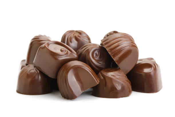 Beautiful chocolate candies isolated on white background