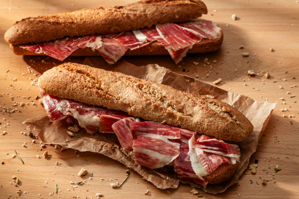 istock Spanish food: two Jamon Iberico Sandwich on wood table 2198941697