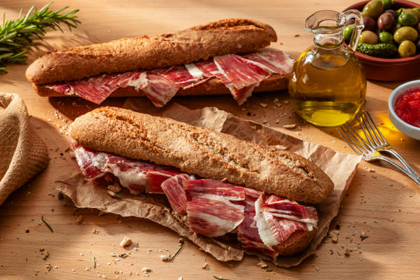 istock Spanish food: two Jamon Iberico Sandwich on wood table 2198941734