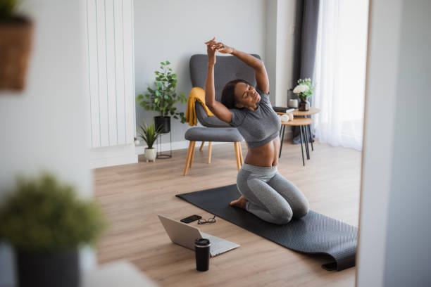 istock Fit woman warming up for a home workout 2198943623