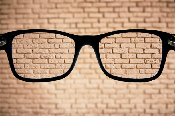 Eyeglasses focusing a brick wall
