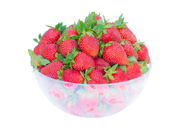 a whole strawberry in a transparent plate