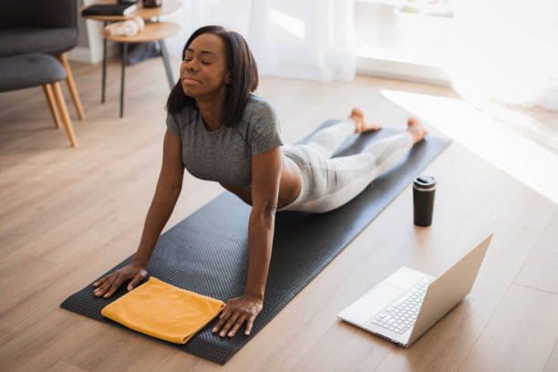 istock Fit woman stretching her back after a workout 2198943824