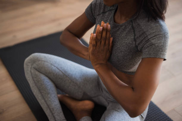 istock Close-up of a woman meditating 2198943848