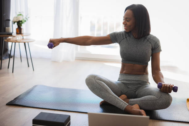 istock Fit black woman lifting weights 2198943944