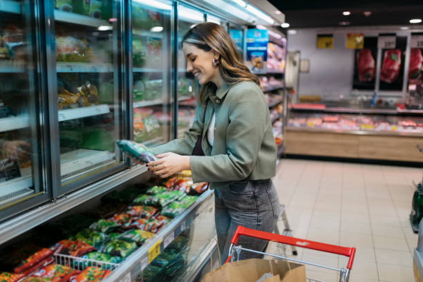 istock Customer buying frozen vegetables in grocery store 2198944936