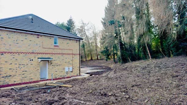 istock Newly Constructed Brick House and Adjacent Cleared Land 2198944975