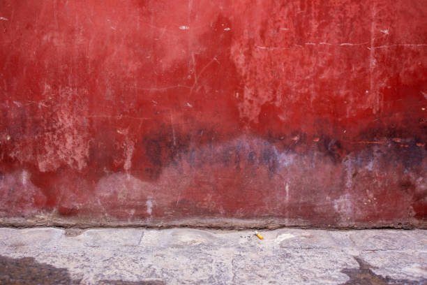 Part of a painted concrete wall.