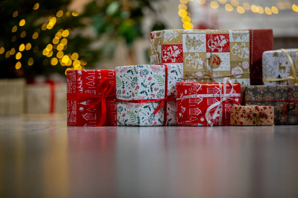 istock Marvelously Beautifully Wrapped Christmas Gifts Placed Under Glowing Festive Lights 2198949683