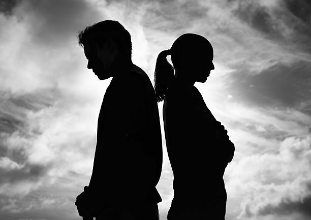 istock Man woman arguing standing with back facing each other. People argument and disagreement concept. 2198950117