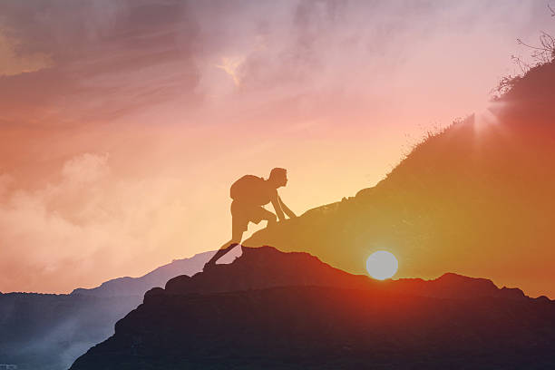 istock A Man Achieving Personal Goals by Climbing a Mountain and Reaching Milestones 2198950470